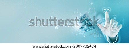 Businessman touching heart shape of service mind  and healthcare business graph growth and medical icon on cube,  Medical examination, medicine, Data analysis on network screen, Medical business.   Royalty-Free Stock Photo #2009732474