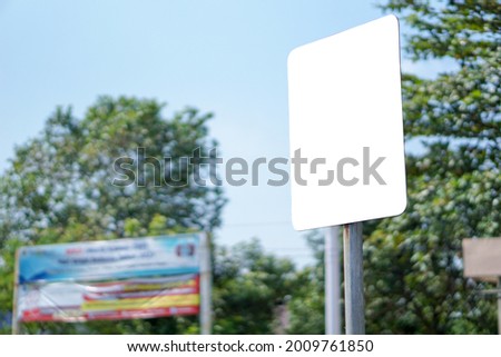 Blank white rectangular traffic sign, natural background, mockup traffic sign