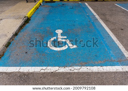 Parking space reserved for people with disabilities in wheelchairs