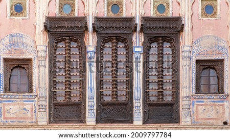 Wooden doors of a haveli in Radjastan Royalty-Free Stock Photo #2009797784