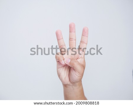 right hand a man show the third, number three sign. isolated on white background