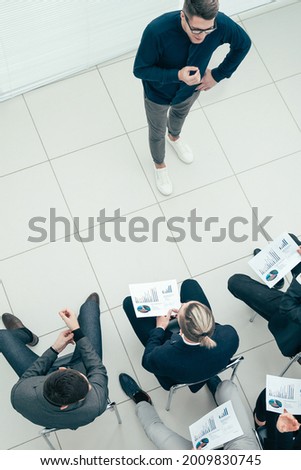 business team reporting results at a working meeting.