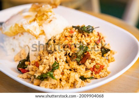 Chicken basil with fried egg