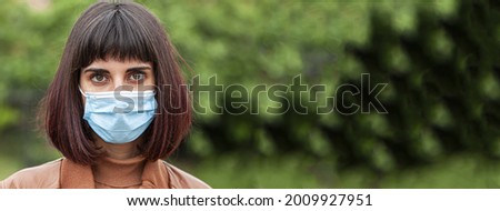 Girl wears mask, banner image with copy space
