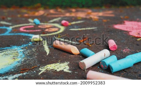 Simple Chalk Drawings Art on Sidewalk Pavement in Public City Park Made By Creative Kids Royalty-Free Stock Photo #2009952383