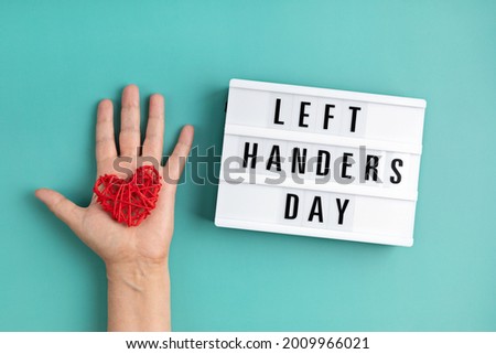 Light box with text left handers day Royalty-Free Stock Photo #2009966021