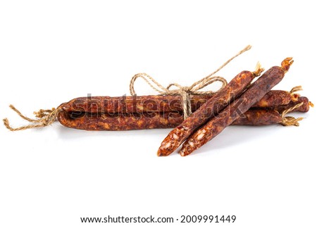 Close-up of smoked sausages with lard isolated on a white background