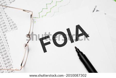 What foia . Conceptual background with chart ,papers, pen and glasses