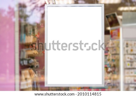 White mockup or white advertising poster on the facade of the store. Promotional information for marketing ads and details