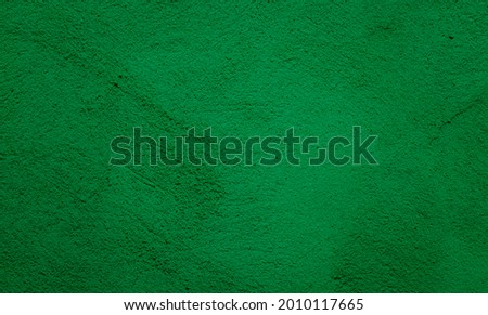 Beautiful dark green stucco Background. Abstract Grunge Decorative Plaster Wall backdrop. Decorative artistic Wall room Close up. Rough Surface plaster Texture With creative pattern
