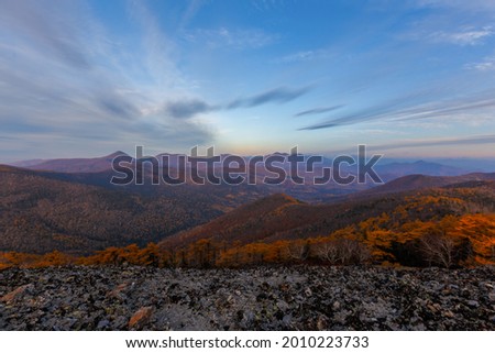 Sikhote-Alin Biosphere Reserve. The rocky slope of Mount Lysaya. See from above. View of the beautiful valley of the Blagodatnoye tract during dawn.