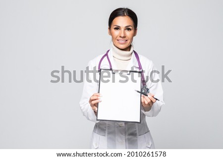 medical doctor woman smile with stethoscope clipboard with empty copy space, concept of advertisement product. Isolated over white background