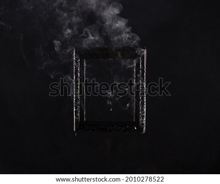 Victorian vintage frame on fire on black background