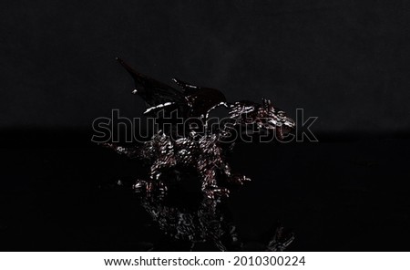black dragon statue on a black background