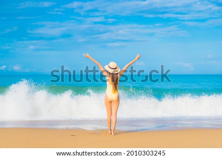 Portrait beautiful young asian woman relax smile leisure around outdoor tropical sea beach ocean in travel vacation