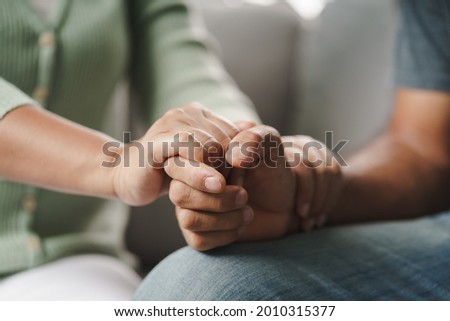 Female friend or family sitting and hold hands during cheer up to mental depress man, Psychologist provides mental aid to patient. PTSD Mental health concept
 Royalty-Free Stock Photo #2010315377