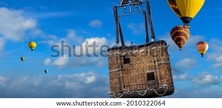 Hot Air Balloon Ride with close view in a basket. Panoramic landscape of Ballooning with place for your tourists on a template for wide banner of travel agency or adventure tour. Royalty-Free Stock Photo #2010322064