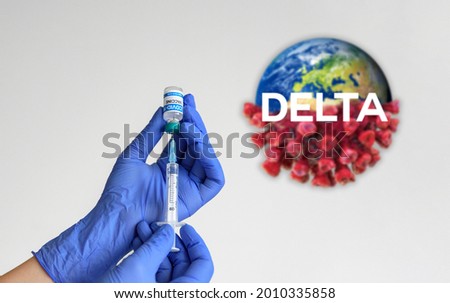 Hand in gloves holding syringe and vaccine for covid-19  Word delta for delta variant of new corona virus and virus icon 