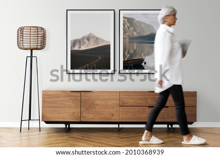 Senior woman walking in a Japandi living room
