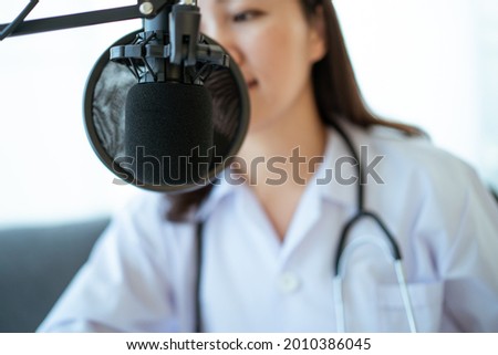 Asian doctor making an online video conference with her patient, tele medical service concept. Female doctor making a medication advise via online podcast.