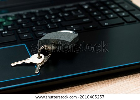 closed padlock with keys on the laptop keyboard concept data protection internet censorship. High quality photo