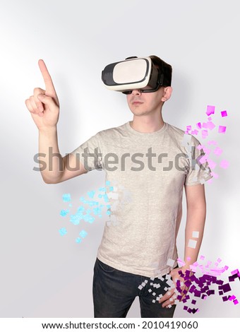 Slim young guy in VR glasses, isolated on a neutral background, crumbling into pixels. Experience in virtual reality, interaction with objects. Teleportation to virtual reality. Dissolve into pixels 
