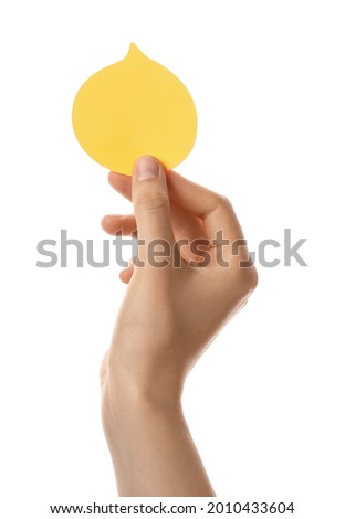 Female hand with blank note paper on white background