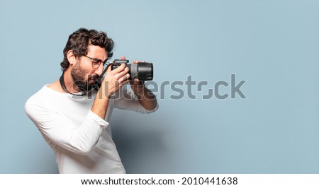 young crazy bearded photographer man
