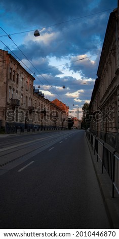 vertical picture ordinary street car road in morning time silent outdoor environment 