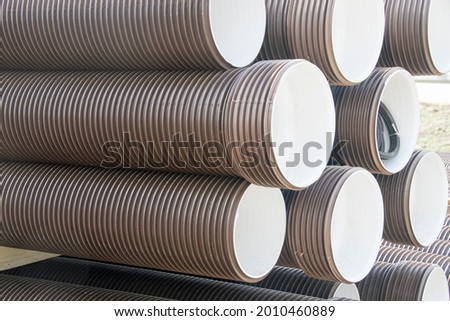 brown plastic pipes for water supply or sewerage prepared for installation or repair of the water supply system