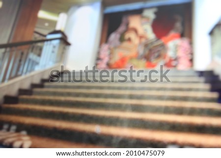 Blurred of luxury staircase and picture in frame in the hotle