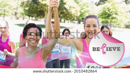 Composition of pink breast cancer ribbon over group of smiling women. breast cancer positive awareness campaign concept digitally generated image.