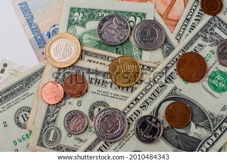 Dollars and coins. Time investment with currency exchange concept.