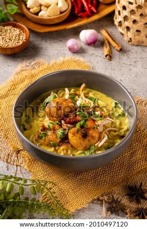 Mie Soto Ayam or Soto Medan with prawn is Traditional chicken soup with Noodle from North Sumatra. 

Soto is a traditional Indonesian soup mainly composed of broth, meat, fried patties and vegetables Royalty-Free Stock Photo #2010497120