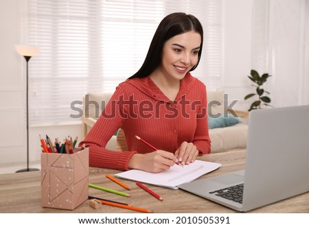 Happy woman drawing picture at online art lesson indoors. Distant learning
