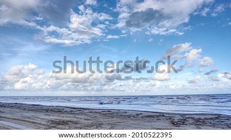 this is a landscape picture of a beach, at sunset, at a local beach.