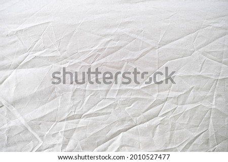 white  gray crumpled old with tent fabric page paper texture rough background. crease grunge parchment pattern vintage design Royalty-Free Stock Photo #2010527477
