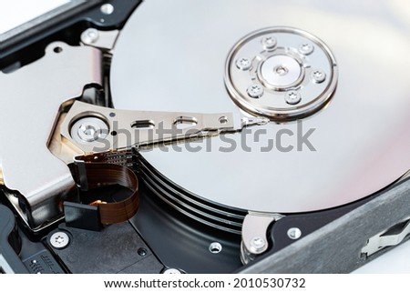 Open hard disk drive close up. Information, cloud data storage, infrastructure cost concept