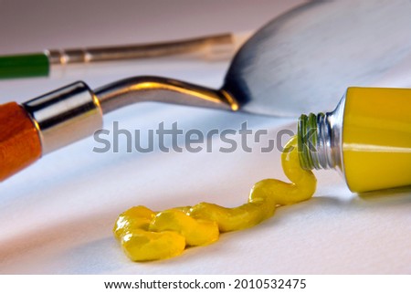 Arts and Crafts - Painting with oil paints, a type of slow-drying paint that consists of particles of pigment suspended in a drying oil, commonly linseed oil. Royalty-Free Stock Photo #2010532475