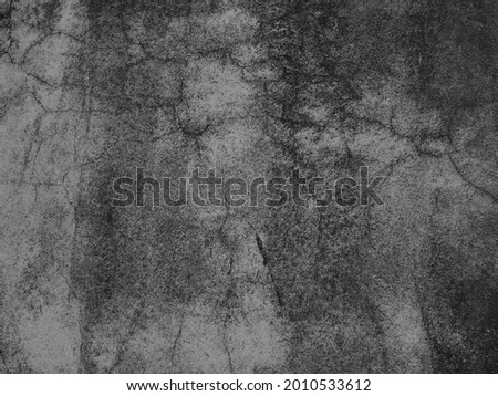 Black and white background, rough texture, looks like a cement floor for background or advertising text.