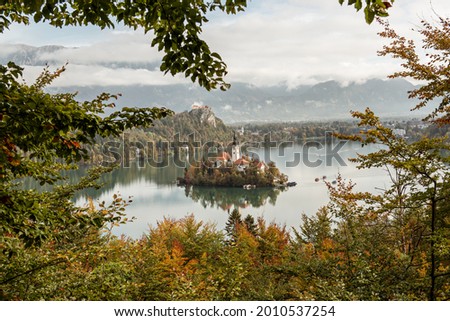 View to the church of Assumption in Lake Bled, Slovenia in the autumn with colorful trees
