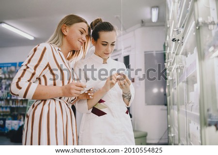 Woman pharmacist checking medicine in pharmacy
