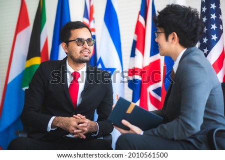 the photo of sucessful team global business partnership, international flag carriers, businessman dealing job, worldwide network in business sign agreement.