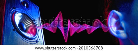 Sound wave. Transfer of sound from the speaker to the human ear. Loud noise. Deafness. Royalty-Free Stock Photo #2010566708