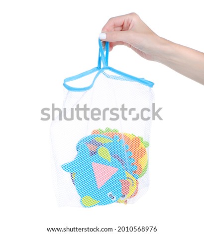 Baby bath toys in hand on white background isolation