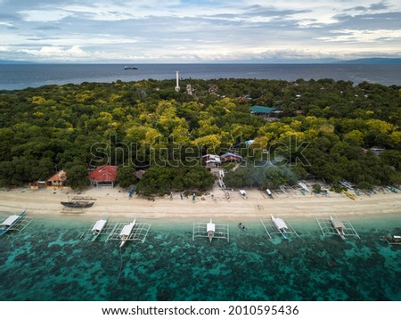 Scenic Aerial Drone Panorama Picture of A White Sand Beach with Bangka Boats in  Balicasag Island in Panglao, Bohol, Philippines