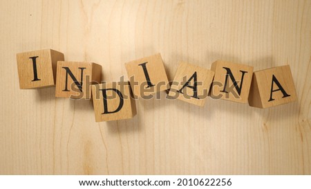 The word Indiana was created from wooden letter cubes. Cities and words. close up.