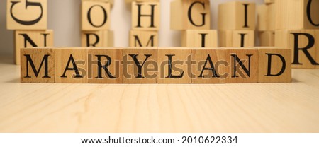 The word Maryland was created from wooden letter cubes. Cities and words. close up.