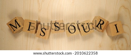 The word Missouri was created from wooden letter cubes. Cities and words. close up.