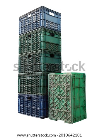 Empty old plastic crate, green and blue that are stacked up in several leaves on a white background. Isolated. Royalty-Free Stock Photo #2010642101